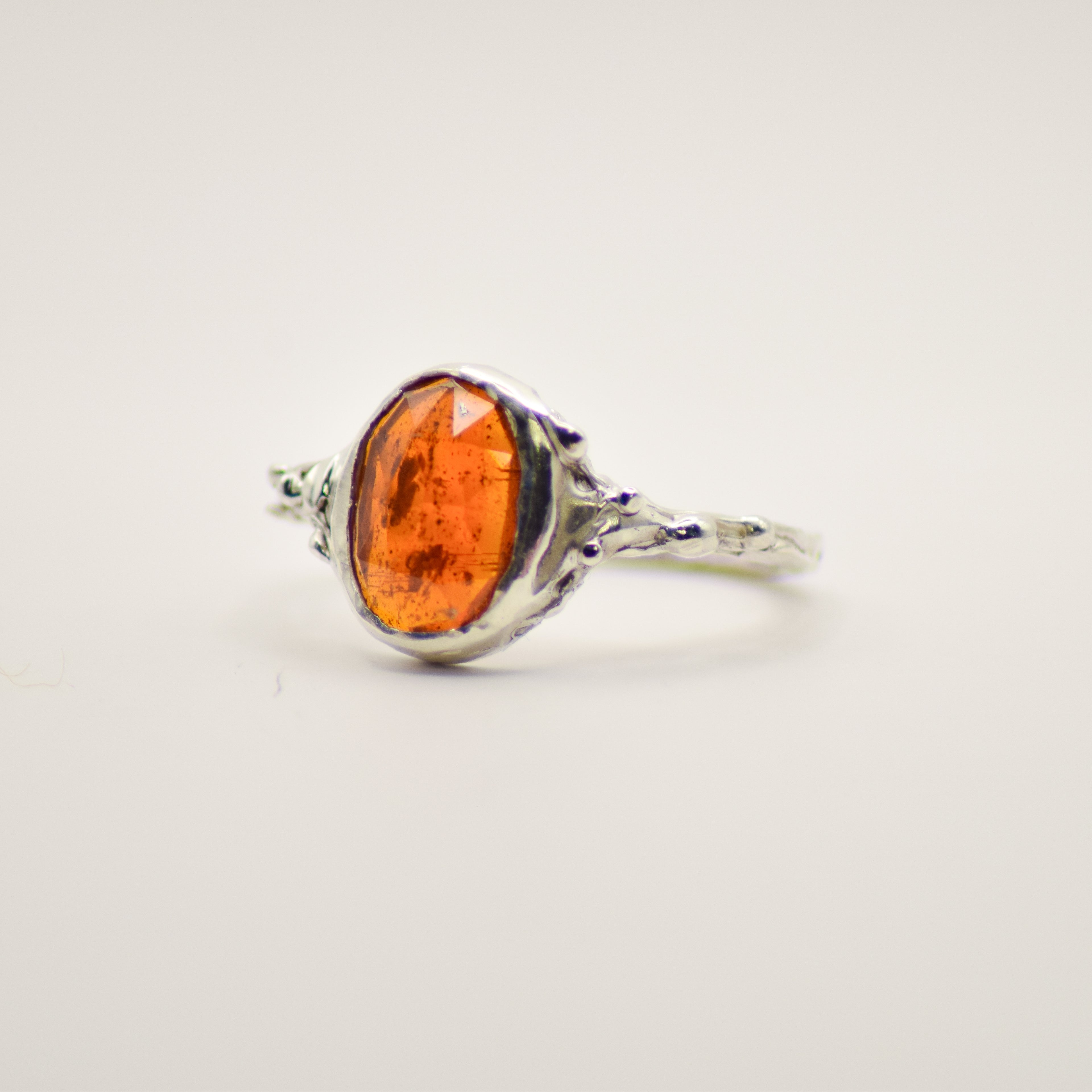 Small orange kyanite ring