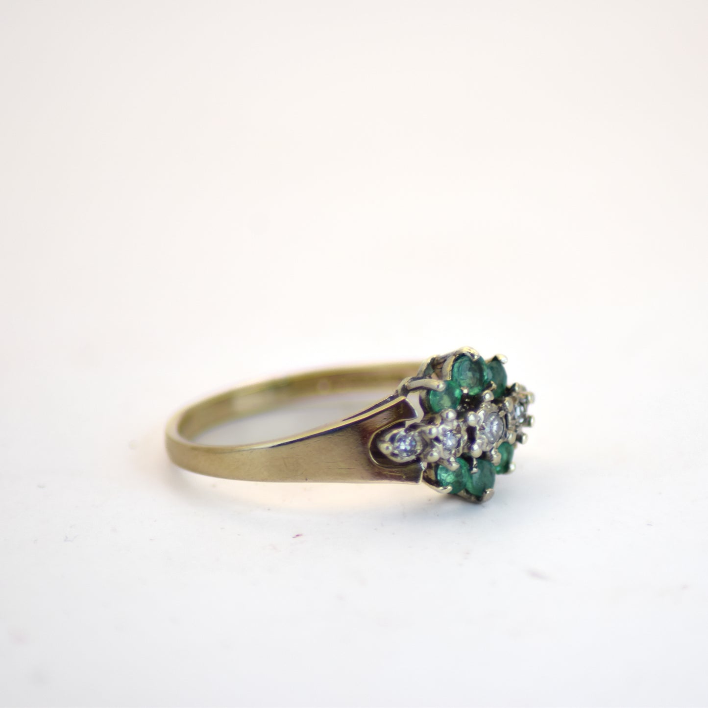Emerald cluster diamond ring