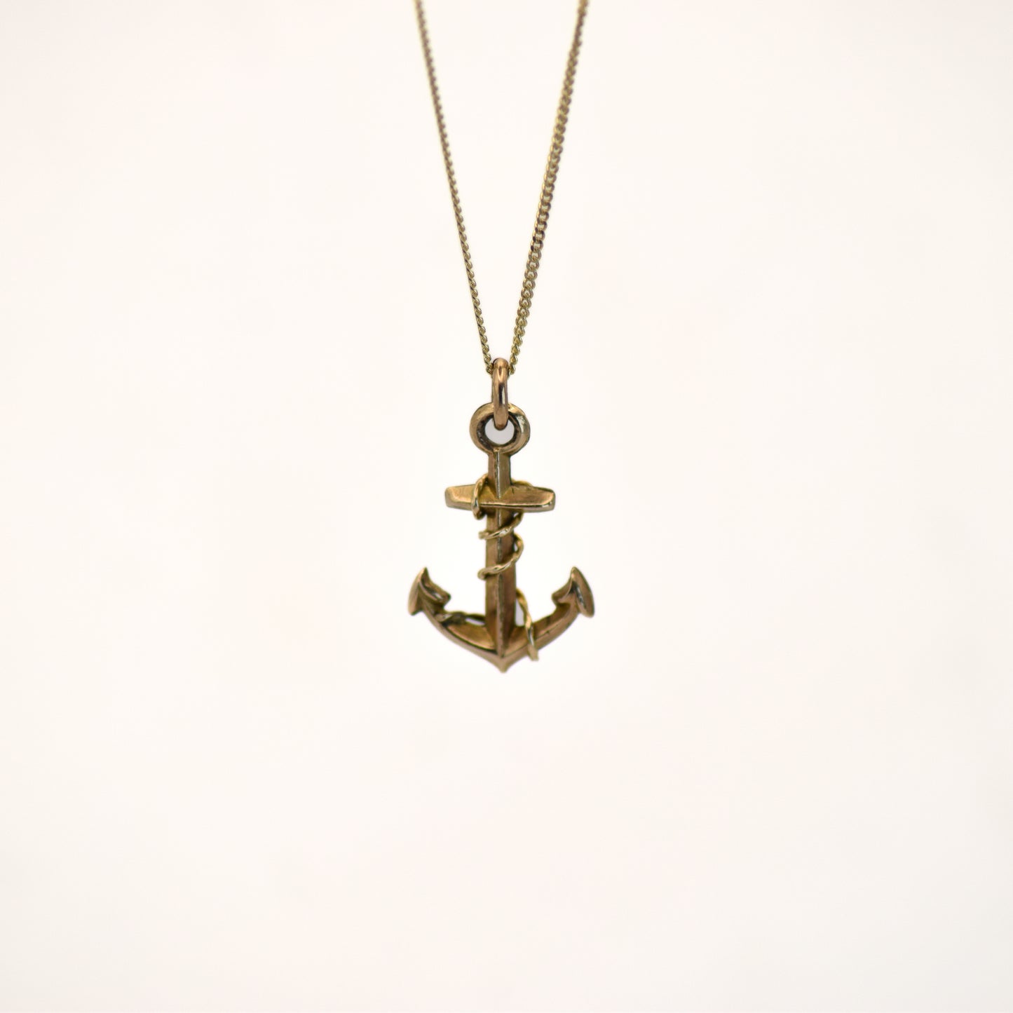 Gold anchor charm